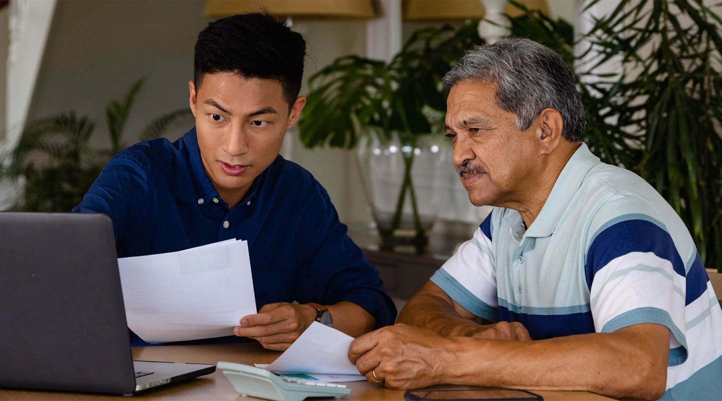 son helping senior parent with finance